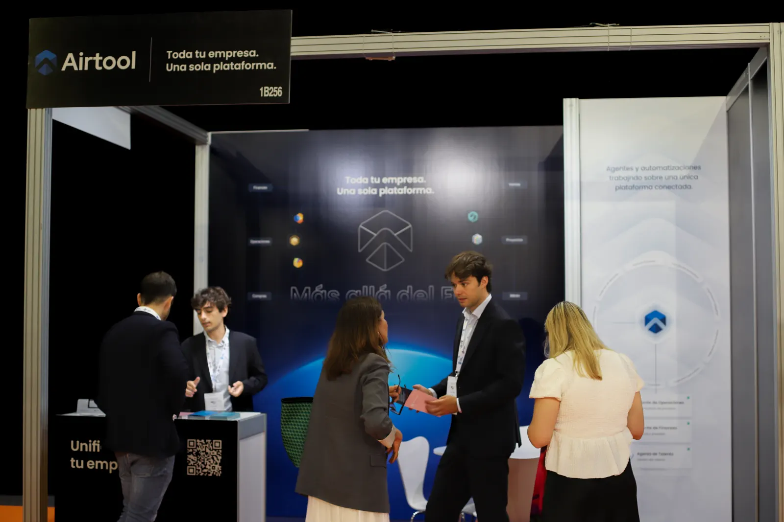 A busy moment at the Airtool booth with several simultaneous conversations